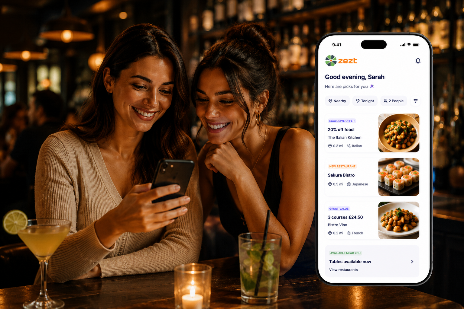Two young women in bar booking on the ZEZT app